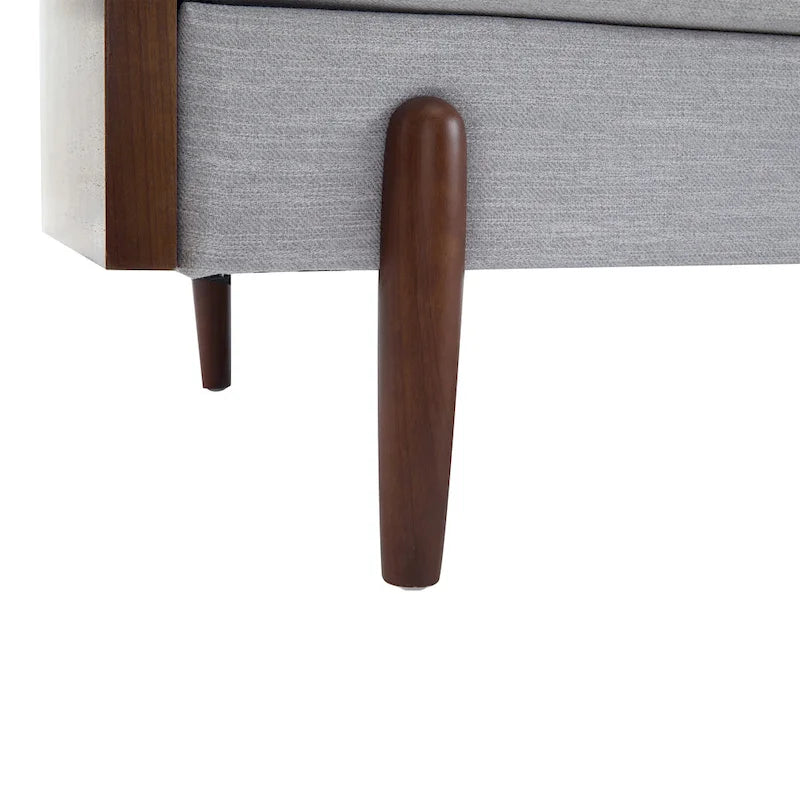 The sofa features a mid-century modern design, which is elegant and sophisticated.