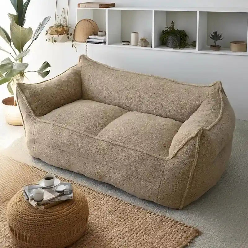 A sectional sofa with a light brown, lambskin-like texture.