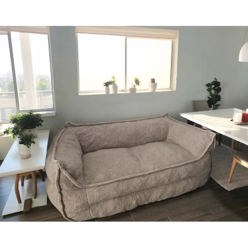 A sectional sofa with a light brown, lambskin-like texture.