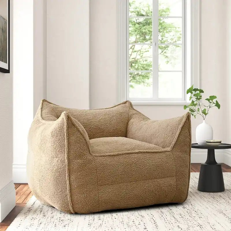 A sectional sofa with a light brown, lambskin-like texture.