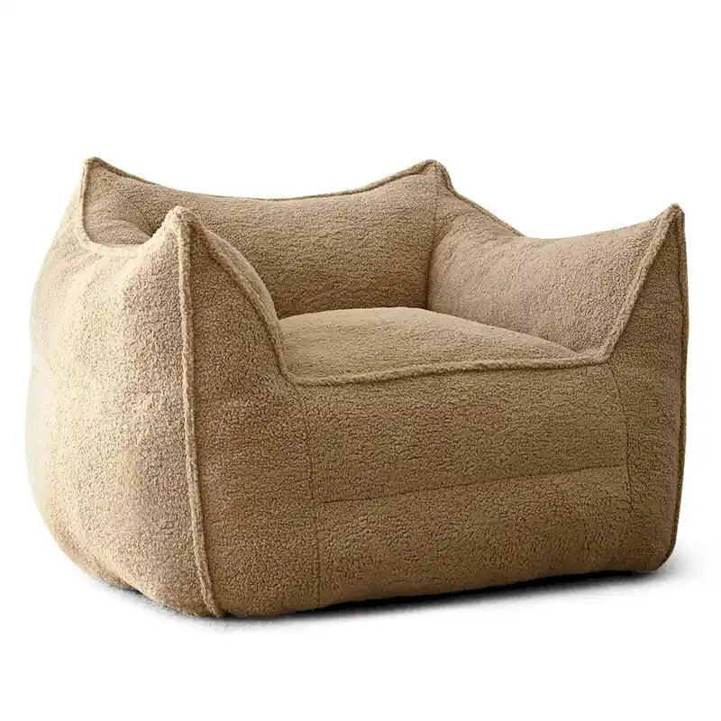A sectional sofa with a light brown, lambskin-like texture.