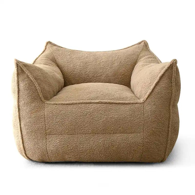A sectional sofa with a light brown, lambskin-like texture.