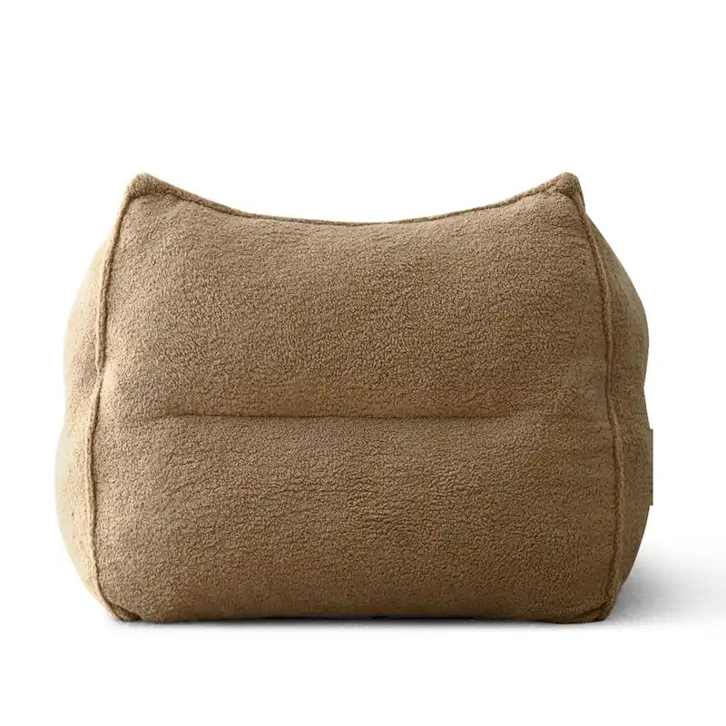 A sectional sofa with a light brown, lambskin-like texture.