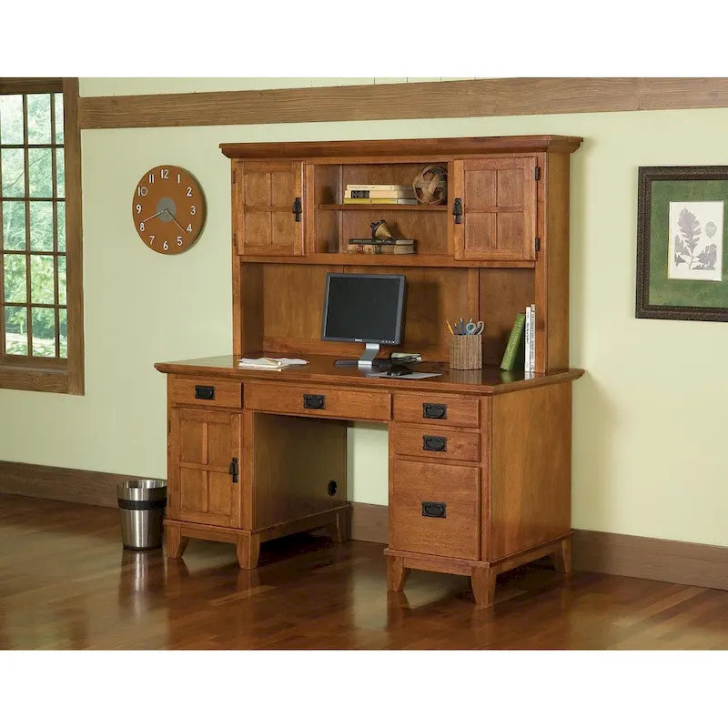 Craftsman-style wooden desk and bookshelf combination with a cabin-like base.