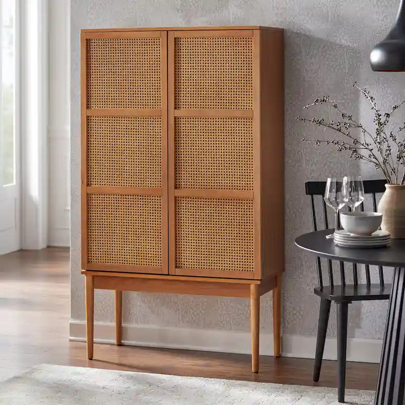 This rattan-woven vintage-style sideboard features rattan woven door panels, tapered solid wood legs, and adjustable shelves.