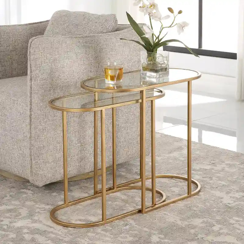 Oval nesting coffee table set with antique brushed bronze iron frame and tempered glass tabletop.