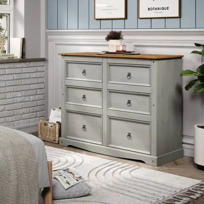 52.36 inches wide, this country-style storage cabinet features drawers in various sizes.