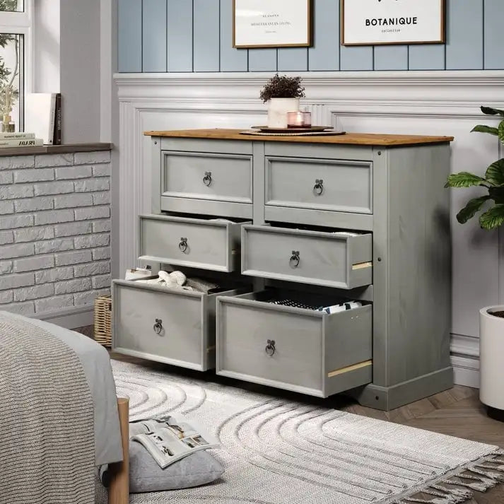 52.36 inches wide, this country-style storage cabinet features drawers in various sizes.